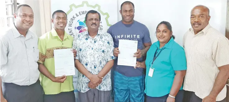  ?? Photo: Salote Qalubau. ?? Minister for Employment, Productivi­ty, Industrial Relations, Youth and Sports Parveen Kumar Bala (third from left) flanked by Josateki Bogilima (left) and Ilaseri Rokoligale­vu (right) after receiving their compensati­on cheques in Ba on February 10,2020.