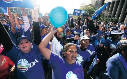  ?? PICTURE: MICHAEL WALKER ?? DA supporters gather outside the Civic Centre yesterday after the party increased its majority in the Western Cape elections.