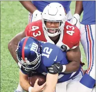  ?? Al Bello / Getty Images ?? Linebacker Haason Reddick (43) of the Arizona Cardinals tackles quarterbac­k Daniel Jones (8) of the New York Giants for the sack in the fourth quarter of the game at MetLife Stadium on Sunday in East Rutherford, N.J. Reddick had five sacks in the Cardinals’ 26-7 win.