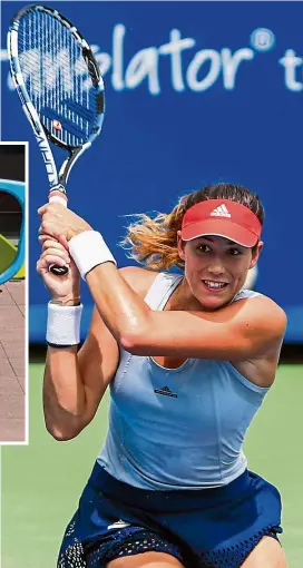  ?? — EPA / AP ?? Start spreading the news: Garbine Muguruza is a fan of the country life and knows New york presents a very real challenge. Inset: A man taking a photo of his daughter standing behind giant sunglasses at the usTA Billie Jean King National Tennis Centre on sunday.