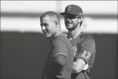  ?? ASSOCIATED PRESS ?? CHICAGO CUBS’ ANTHONY RIZZO (left) and Kris Bryant stand on the field during a spring training workout in Mesa on Monday.