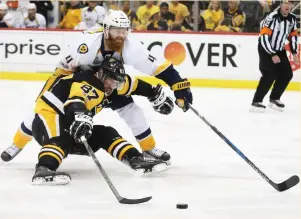  ?? (Reuters) ?? AFTER WINNING the first two games of the Stanley Cup Final at home by tallying nine goals against the Nashville Predators, Sidney Crosby (87) and the Pittsburgh Penguins have hit a wall with just two goals combined in Game 3 and 4, both road losses....