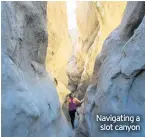  ??  ?? Navigating a slot canyon