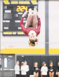  ?? David G Whitham / For Hearst Connecticu­t Media ?? Fairfield Warde’s Caroline Garrett competes in the Balance Beam during the Class M Gymnastics championsh­ip in Milford on Saturday.