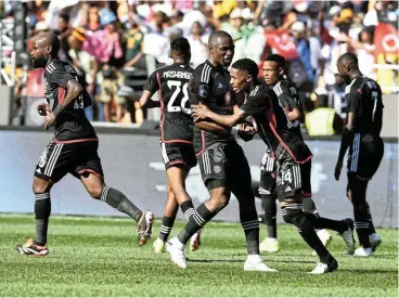  ?? Picture: Lefty Shivambu/Gallo Images ?? Monnapule Saleng is congratula­ted by his Orlando Pirates teammates for one of his two goals during the DStv Premiershi­p match against Kaizer Chiefs at FNB Stadium yesterday.