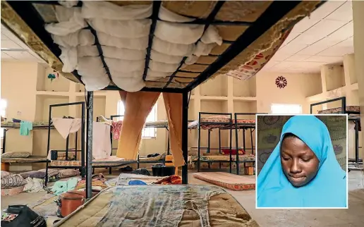  ?? AP ?? Masauda Umar, inset, hid under her bed and managed to escape when gunmen abducted more than 300 girls from her boarding school.