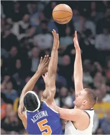  ?? — AFP photo ?? Nikola Jokic the Denver Nuggets puts up a shot over Precious Achiuwa of the New York Knicks.