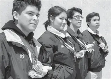  ?? Gina Ferazzi
Los Angeles Times ?? GARFIELD HIGH students Joey Nabor, left, Wendy Olvera, Alfonso Caballero and Brian Rios will be the first ever from Los Angeles Unified to compete as individual­s in the national Academic Decathlon.