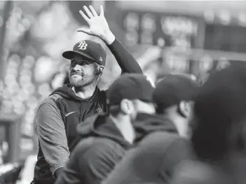  ?? Karen Warren / Staff photograph­er ?? Rays pitcher Collin McHugh acknowledg­es the crowd after a video appreciati­on of his six-season stint (2014-19) with the Astros was played before the start of Tuesday night’s game.