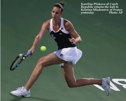  ??  ?? Karolina Pliskova of Czech Republic returns the ball to Kristina Mladenovic of France yesterday Photo: AP