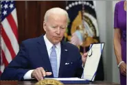 ?? AP ?? President Biden signs into law the Bipartisan Safer Communitie­s Act gun safety bill, in the Roosevelt Room of the White House in Washington, D.C., on Saturday.