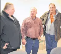  ?? ERIC MCCARTHY/JOURNAL PIONEER ?? Ronnie MacWilliam­s, center, chairman of the P.E.I. Farm Practices Review Board, chats with fellow members of the board, Dan MacKinnon, left, and Edwin McKie. They, along with board member John Bysterveld­t, comprised the board’s panel that met recently...