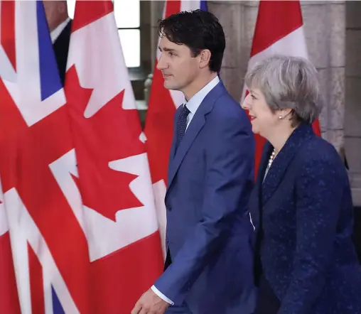  ?? PHOTO AFP ?? Le premier ministre canadien a également rencontré son homologue britanniqu­e, Theresa May, hier à Ottawa.