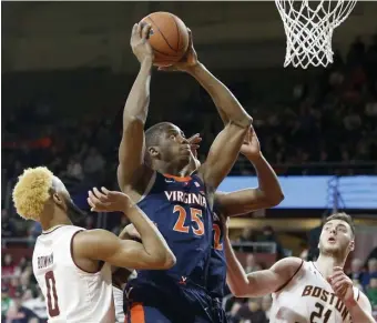  ?? ASSOCIATED PRESS ?? NO CONTEST: Mamadi Diakite goes up for two of his 18 points in No. 4 Virginia’s 8356 rout of Boston College last night at Conte Forum.
