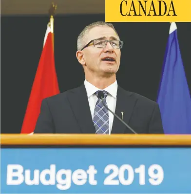  ?? IAN KUCERAK / POSTMEDIA FILES ?? Alberta Finance Minister Travis Toews speaks Thursday about Budget 2019, the United Conservati­ve Party’s first, which will see the eliminatio­n of bureaucrat­ic jobs and cuts to spending to head off a “fiscal crisis.”