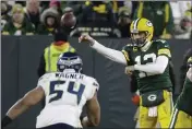  ?? MIKE ROEMER — THE ASSOCIATED PRESS ?? The Green Bay Packers’ Aaron Rodgers, a Chico native, throws during the second half of a divisional playoff game Sunday against the Seattle Seahawks in Green Bay, Wis.