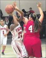  ?? Photo by Ernest A. Brown ?? Tolman's Fenda Konte (12) shoots despite defensive pressure from Mount's Sky O'Connell (40) during first-half action at Tolman Tuesday night.