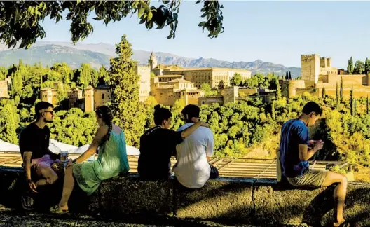  ?? EMILIO P. DOIZTUA NYT PHOTOS ?? Alhambra, the crown of all Moorish castles, hovers above the city like a mirage in Granada, Spain. It was the final stronghold of the last Muslim rulers in Spain.