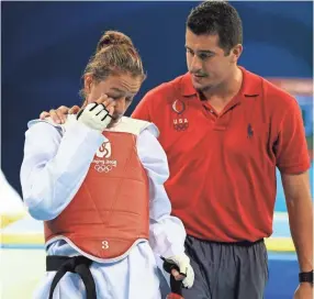  ??  ?? Jean Lopez, right, has coached siblings Steven, Mark and Diana in the Olympics. EILEEN BLASS/USA TODAY SPORTS