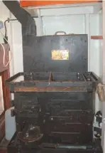  ??  ?? ABOVE Proper coal fired stove in the galley has heavy fiddles to keep pans safe and also heats water
BELOW Safe is housed in the wardroom