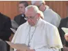  ?? L’OSSERVATOR­E ROMANO VIA AP ?? Pope Francis prays with members of the Roman curia Friday at the village of Ariccia, near Rome.