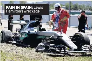  ??  ?? PAIN IN SPAIN: Lewis Hamilton’s wreckage