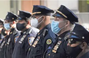  ?? MARK LENNIHAN/AP FILE ?? New York’s vaccine mandate comes amid new uproar over NYPD officers defying even simple measures, like wearing face masks.