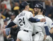  ?? CHRIS O’MEARA - THE ASSOCIATED PRESS ?? Tampa Bay Rays’ Kevin Kiermaier, right, celebrates his 3-run home run in the second inning against the Houston Astros with Avisail Garcia (24) during Game 3 of a baseball American League Division Series, Monday, Oct. 7, 2019, in St. Petersburg, Fla.