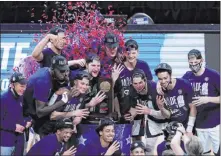  ?? The Associated Press ?? Darron Cummings
Gonzaga players celebrate after beating Southern California 85-66 in the West Regional final. The Bulldogs advance to the Final Four.