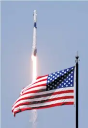  ?? AP PHOTO/JOHN RAOUX ?? A SpaceX Falcon 9, with NASA astronauts Doug Hurley and Bob Behnken in the Dragon crew capsule, lifts off from Pad 39-A on Saturday at the Kennedy Space Center in Cape Canaveral, Fla.