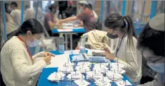  ?? MAYA ALLERUZZO / AP ?? Workers count votes in Israel’s national elections at the Knesset in Jerusalem, Thursday.