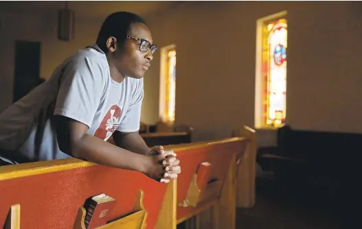  ?? JONATHON GRUENKE/STAFF ?? Philip Carr, 17, created the message, “Life has value to God. Please don’t take that away,” for the sign in front of The First Church of God after speaking to his pastor.