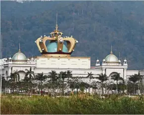  ?? — Reuters ?? A hub for crime: The Kings Romans casino stands in the Golden Triangle special economic zone on the banks of the Mekong river in Laos near the border between Laos, Myanmar and Thailand.