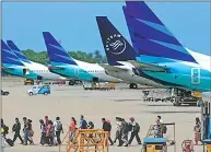  ?? BEAWIHARTA / REUTERS ?? Garuda announces it will open more direct flights from Bali to major Chinese cities.