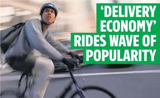  ?? NORMAN LONO ?? More and more couriers ride the streets of New York City as delivery through third- party apps continues to increase.