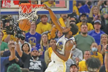  ?? Associated Press ?? Slammed: Golden State Warriors forward Andrew Wiggins (22) dunks against the Boston Celtics during the second half of Game 5 of basketball's NBA Finals Monday in San Francisco.