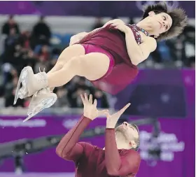  ?? AP ?? Meagan Duhamel and Eric Radford perform today in the pairs free skate figure-skating final in the Gangneung Ice Arena in Gangneung, South Korea.