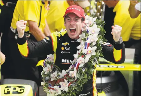  ?? Michael Conroy / Associated Press ?? Simon Pagenaud celebrates after winning the Indianapol­is 500 Sunday at Indianapol­is Motor Speedway in Indianapol­is.