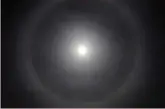  ?? — AP ?? Moon spectacle: A full moon over downtown Joplin, Missouri, displays a ring early on Sunday. According to the US National Weather Service in Springfiel­d, the “Moon Ring” or “Moon Dog” is a rare event and happens when high clouds made of ice crystals...