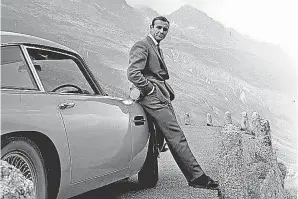  ?? FROM THE BOOK THE ART OF BOND ?? Connery with his “Goldfinger” co- star, an Aston Martin DB5, custom built for the 1964 film.