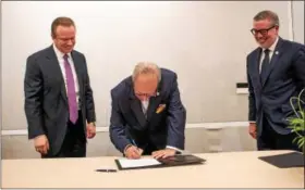  ?? SUBMITTED PHOTO ?? Tower Health is partnering with Drexel University to develop a Berks County branch medical school campus of Drexel University College of Medicine. The agreement was announced Monday. Shown here signing the agreement are left to right: Clint Matthews,...