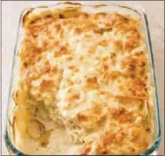  ?? JOE KELLER/AMERICA’S TEST KITCHEN VIA AP ?? This undated photo provided by America’s Test Kitchen in October 2018 shows scalloped potatoes in Brookline, Mass. This recipe appears in the cookbook “Holiday Entertaini­ng.”