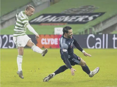  ??  ?? 0 Leigh Griffiths fires Celtic into a 12th-minute lead at Parkhead last night