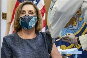 ?? KEN CEDENO — POOL VIA AP ?? In this Friday, Dec. 18, 2020, file photo, Speaker of the House Nancy Pelosi, D-Calif., receives a Pfizer-BioNTech COVID-19 vaccine shot from Dr. Brian Monahan, the Capitol physician, in Washington.