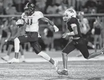  ?? Kin Man Hui / Staff photograph­er ?? Johnson receiver Alejandro Tavarez, left, had five catches for 151 yards and a touchdown Friday against Roosevelt.