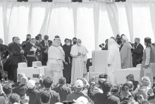  ?? IVOR PRICKETT/NEW YORK TIMES ?? Pope Francis, center, during an interrelig­ious meeting at the ruins of Ur, one of the world’s oldest civilizati­ons and traditiona­lly held to be the birthplace of Abraham, near Nasiriyah, Iraq, on Saturday. Francis used the backdrop of ancient Mesopotami­a as a powerful reminder that what binds humanity can be more powerful than what divides.