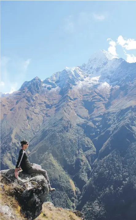  ??  ?? Trekkers get their first look at mighty Mount Everest from the viewpoint near Namche. The perfect weather allowed for a clear view of all the major peaks.