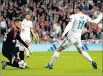  ?? Picture: REUTERS ?? GLOVEMAN’S HORRID SLIPUP: Bayern Munich keeper Sven Ulreich stoops, wrongly, to stop Gareth Bale’s shot in the Champions semifinals