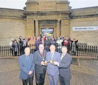  ??  ?? Oswaldtwis­tle library reopens more than a year after it was closed. From left: Peter Hargreaves, the great grandson of Councillor Arthur Hargreaves who first opened the library in 1915, CC Terry Aldridge, chairman of Lancashire County Council, CC Peter Britcliffe, who represents Oswaldtwis­tle, CC Peter Buckley, cabinet member for community and cultural services
