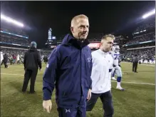  ?? CHRIS SZAGOLA - AP ?? Dallas Cowboys head coach Jason Garrett, center left, walks off the field after losing to the Eagles Sunday in Philadelph­ia.